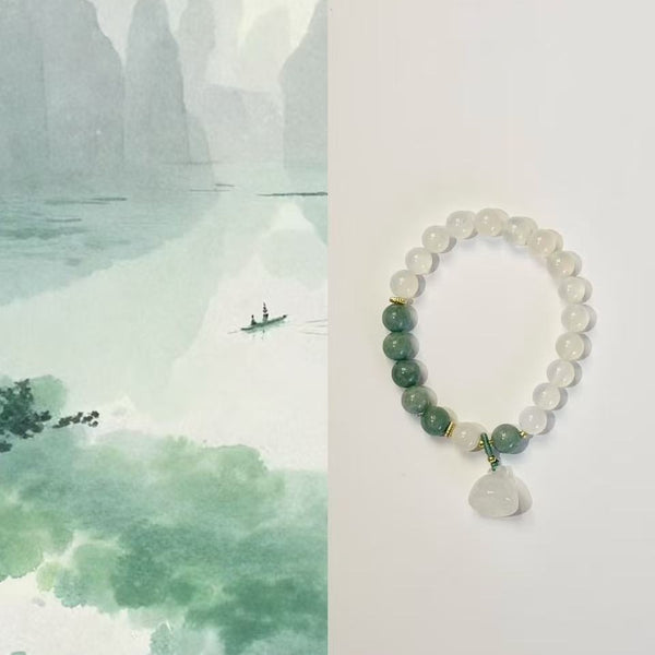 The lotus begets all creation • White jade bracelet